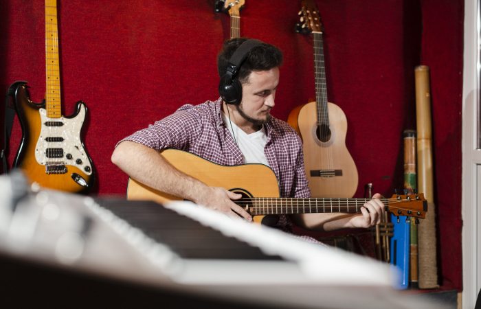 blurred-keyboard-guy-playing-guitar